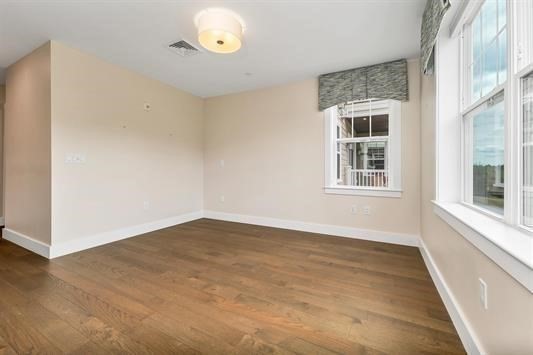 7 Longview Drive, Unit 105 Atkinson, NH 03811 - Photo 17 of 30 an empty room with a window