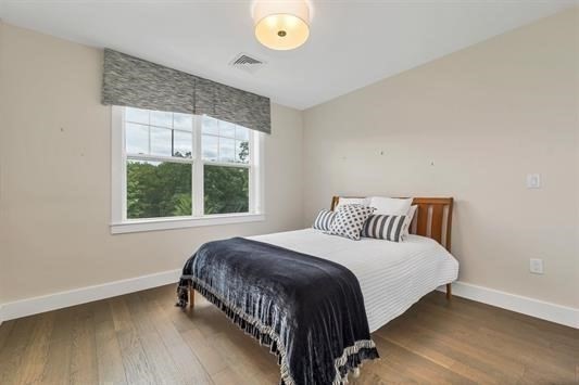 7 Longview Drive, Unit 105 Atkinson, NH 03811 - Photo 18 of 30 a bedroom with a bed and a window