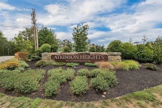 7 Longview Drive, Unit 105 Atkinson, NH 03811 - Photo 29 of 30 a view of a pathway in front of a house