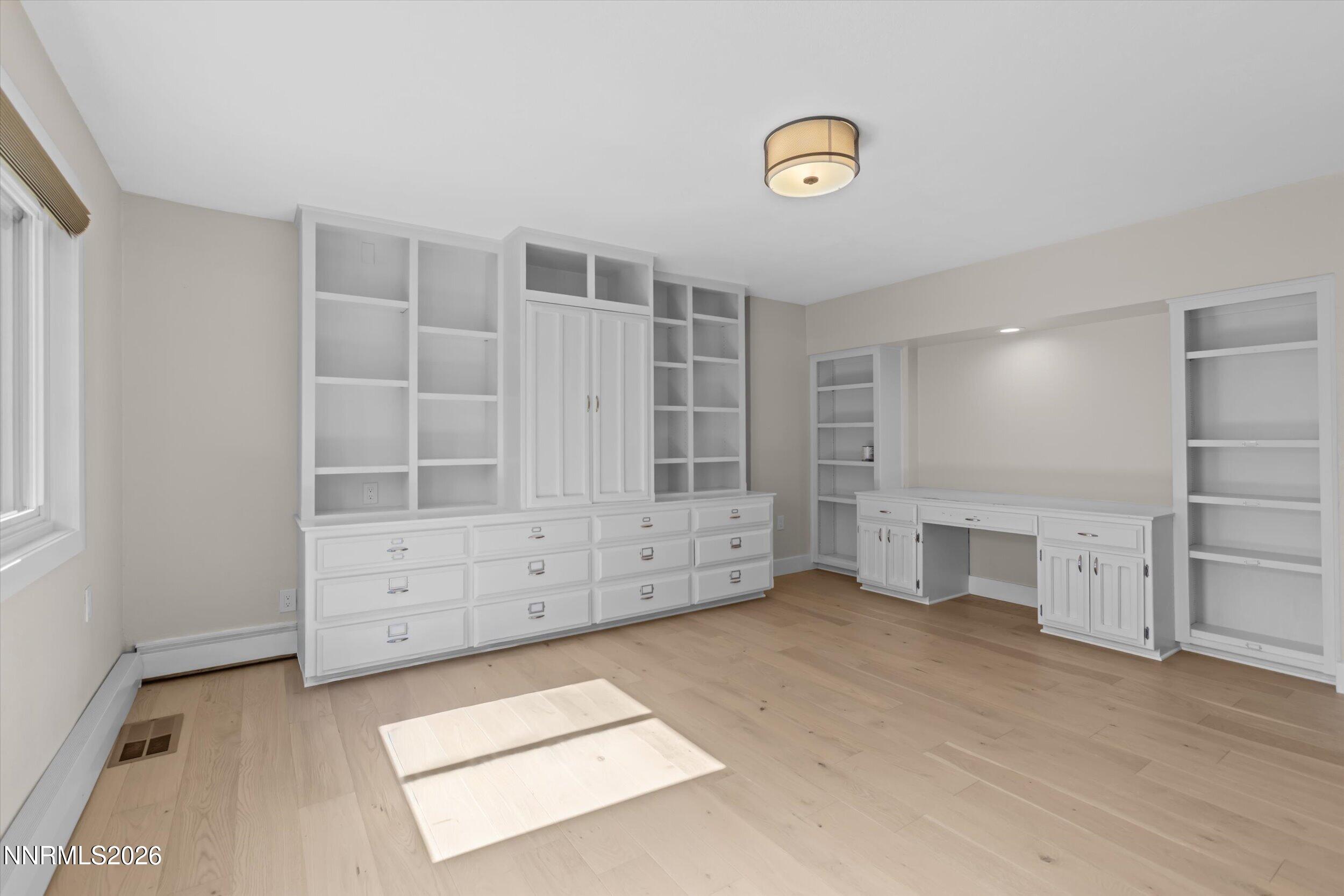 2725 West Lake Ridge Shores Reno, NV 89519 - Photo 41 of 49 an empty room with cabinet and mirrors
