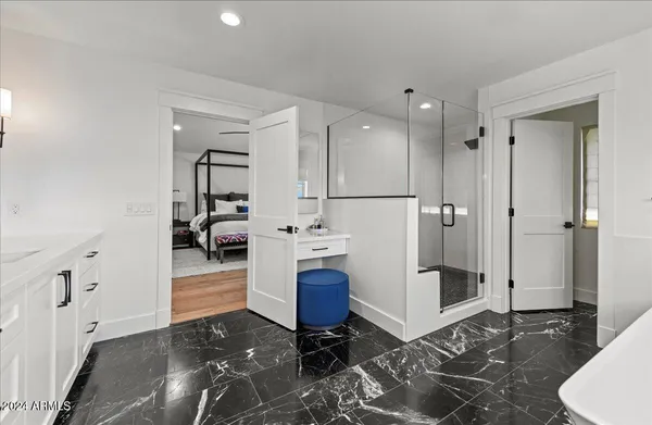 a bathroom with a sink vanity and mirror