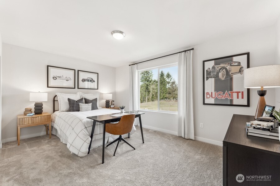 17529 Northeast Midnight Sun Loop Poulsbo, WA 98370 - Photo 32 of 36 a bed room with furniture and a window