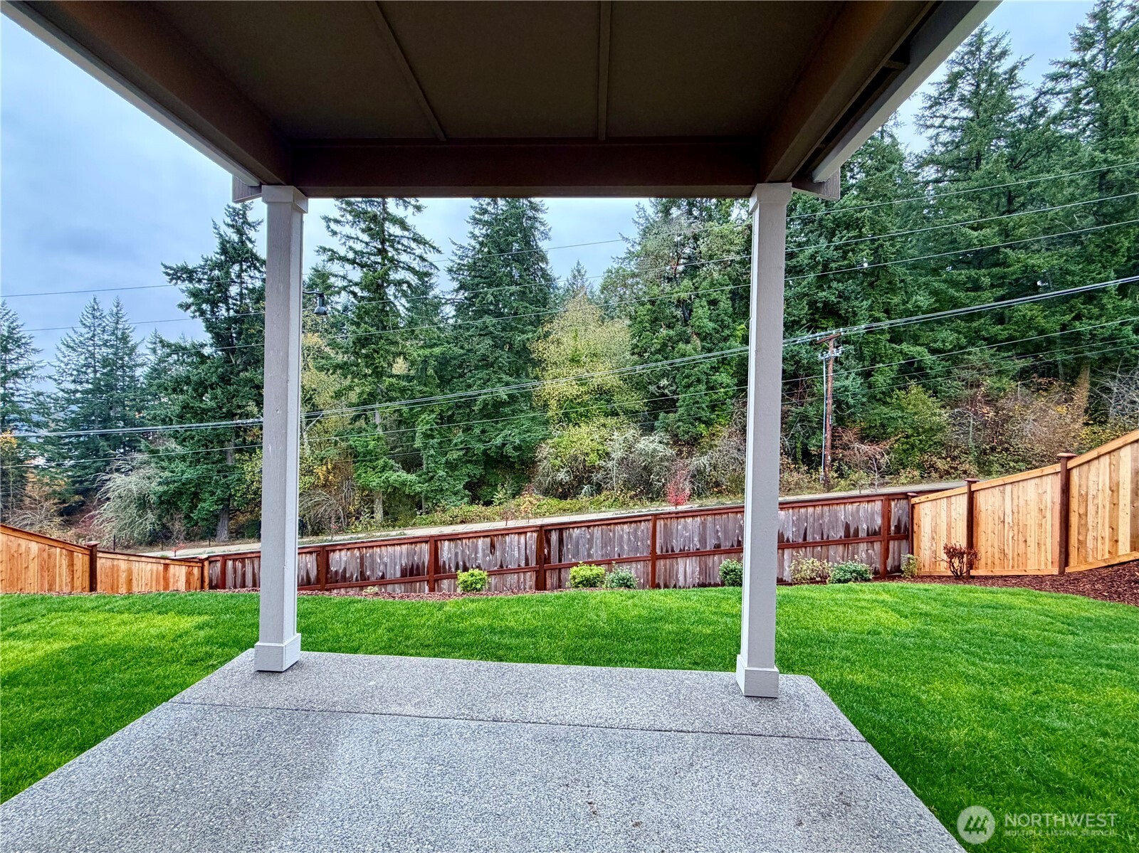 17529 Northeast Midnight Sun Loop Poulsbo, WA 98370 - Photo 6 of 36 a view of a yard with a porch