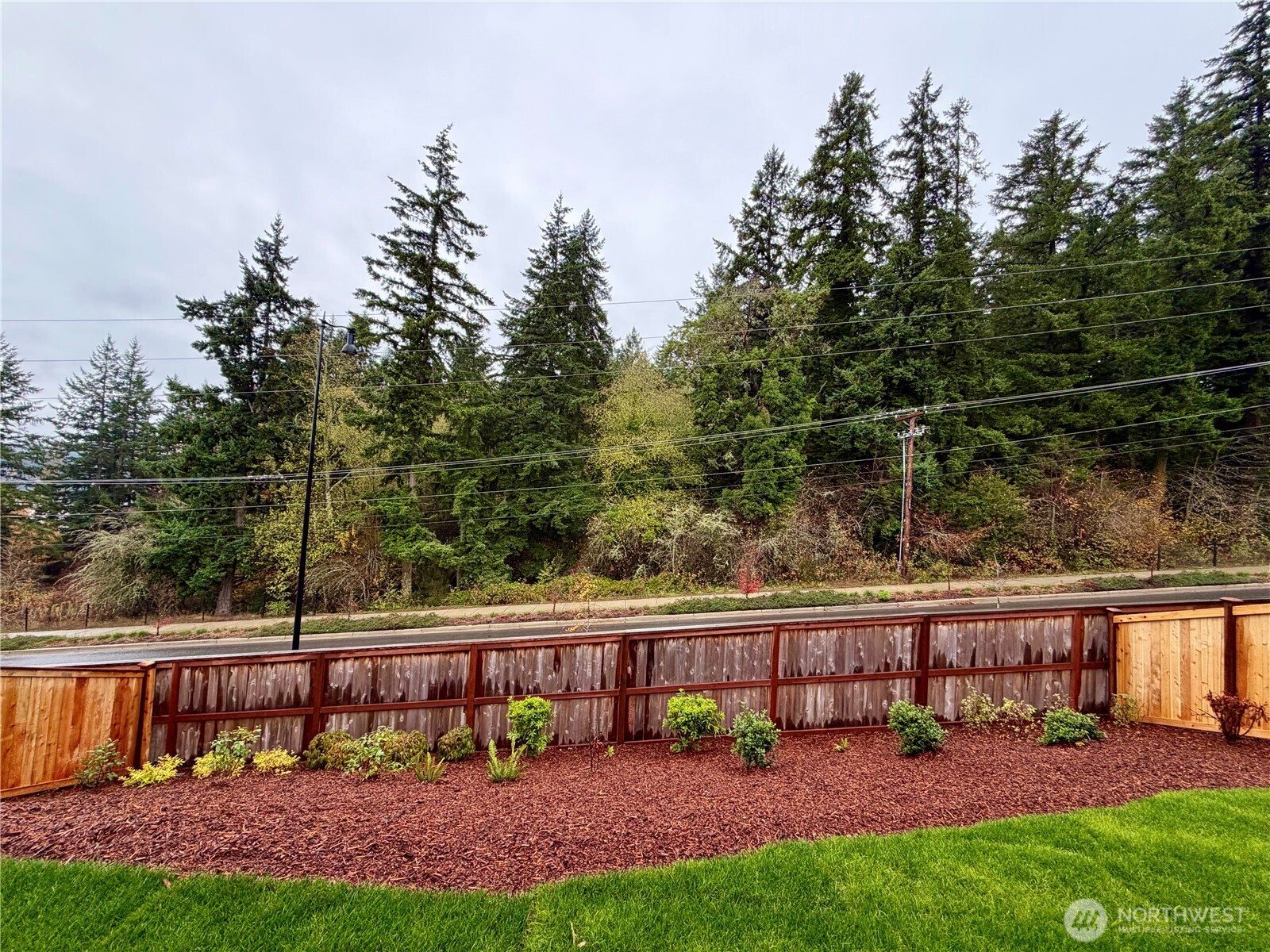 17529 Northeast Midnight Sun Loop Poulsbo, WA 98370 - Photo 7 of 36 a view of a yard with a table and chairs