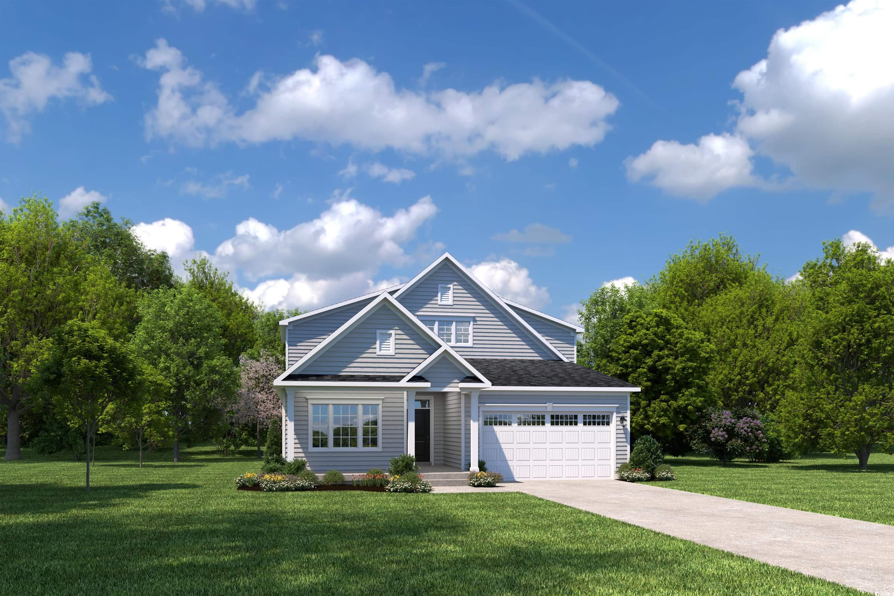 Traditional home featuring a front yard and concrete driveway