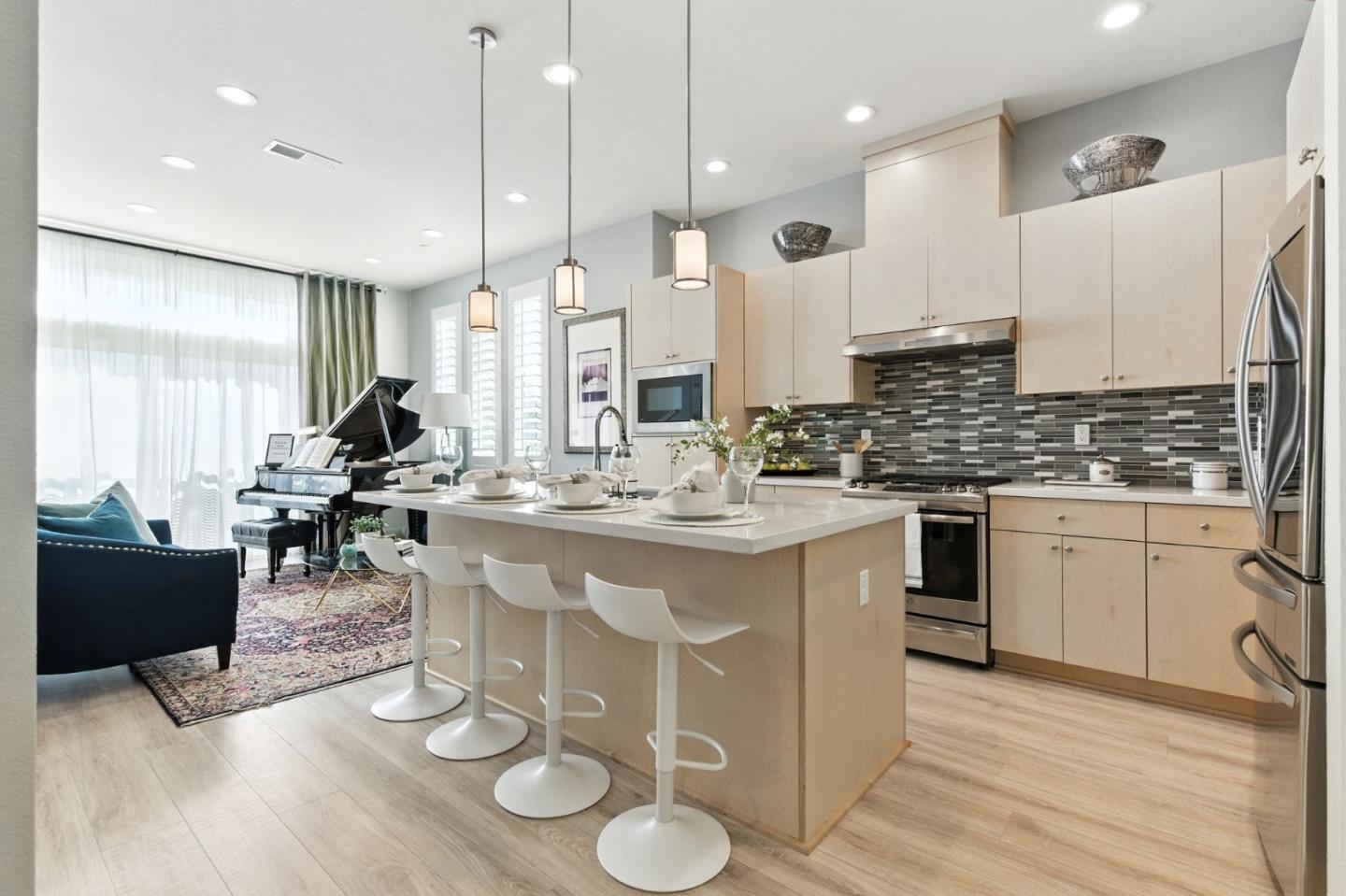 a kitchen with a sink cabinets and wooden floor