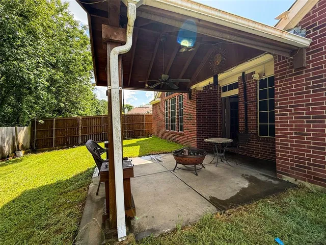 a view of a backyard with swimming pool