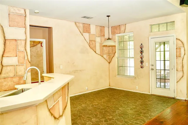 a view of a kitchen with a sink