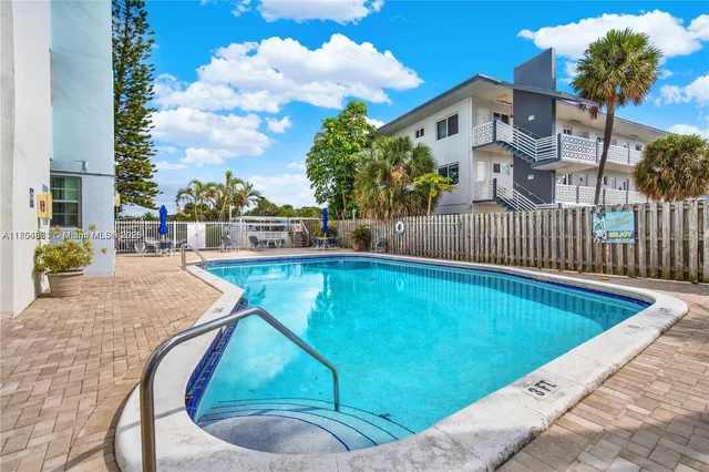 a view of a dining room with furniture and a rug