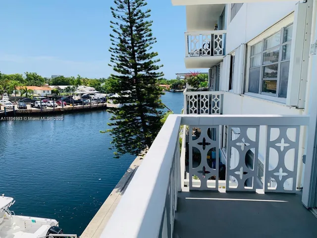 a view of a balcony with chairs and a table