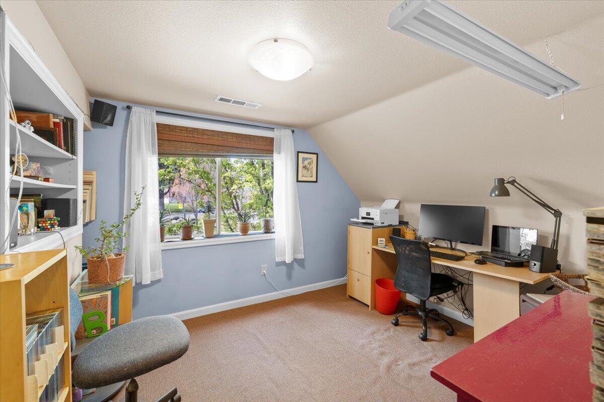 440 Bush Street Central Point, OR 97502 - Photo 20 of 40 a view of a workspace with furniture and a window