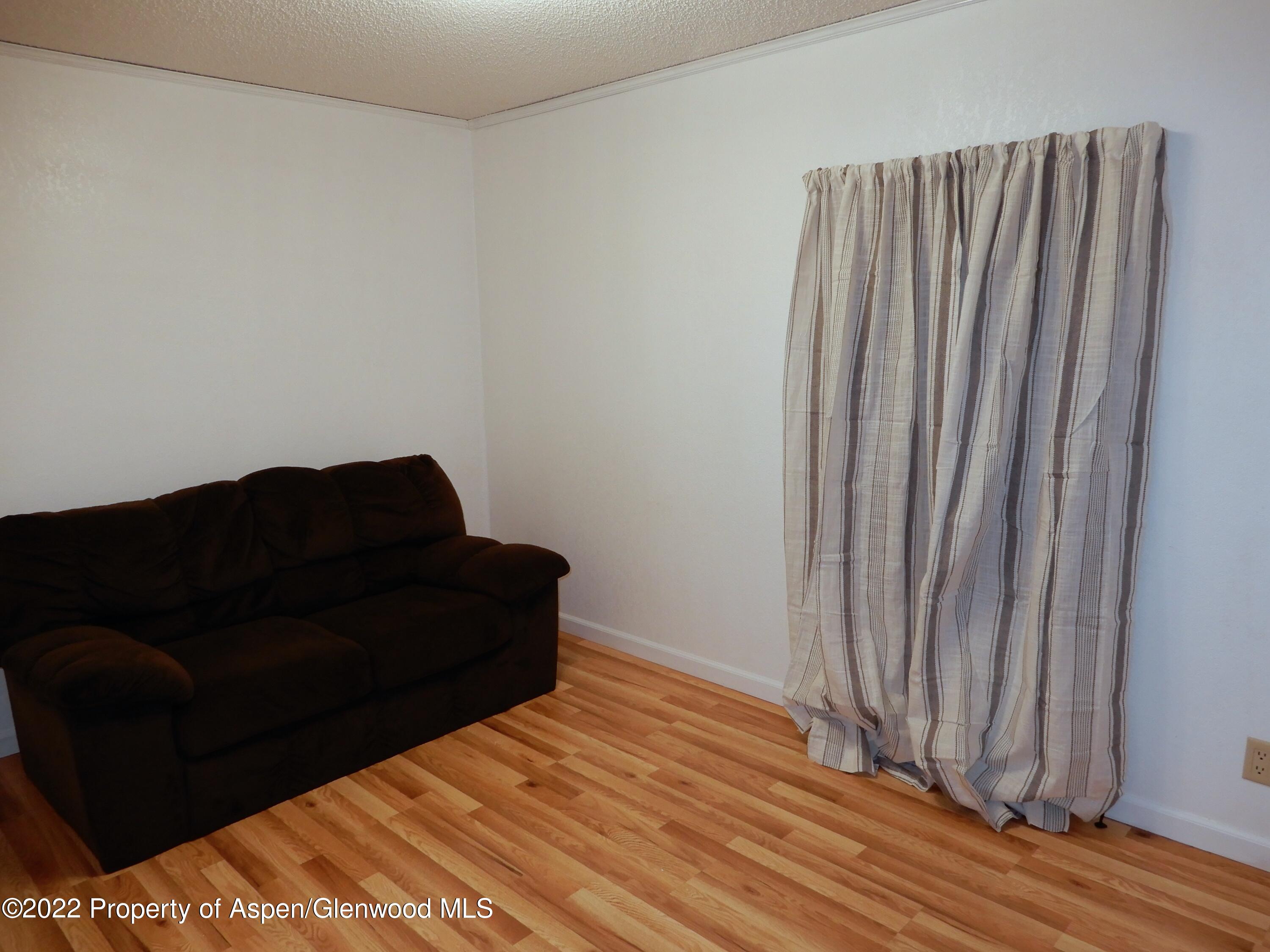 1110 Arnold Court Rifle, CO 81650 - Photo 11 of 23 a black and white door in a bedroom