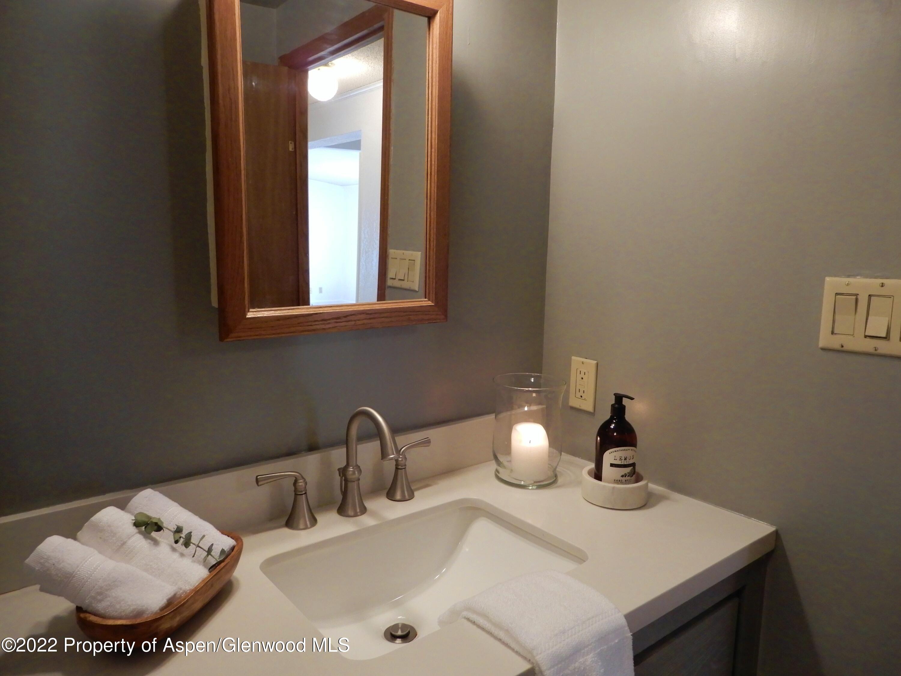 1110 Arnold Court Rifle, CO 81650 - Photo 13 of 23 a bathroom with a sink and a mirror
