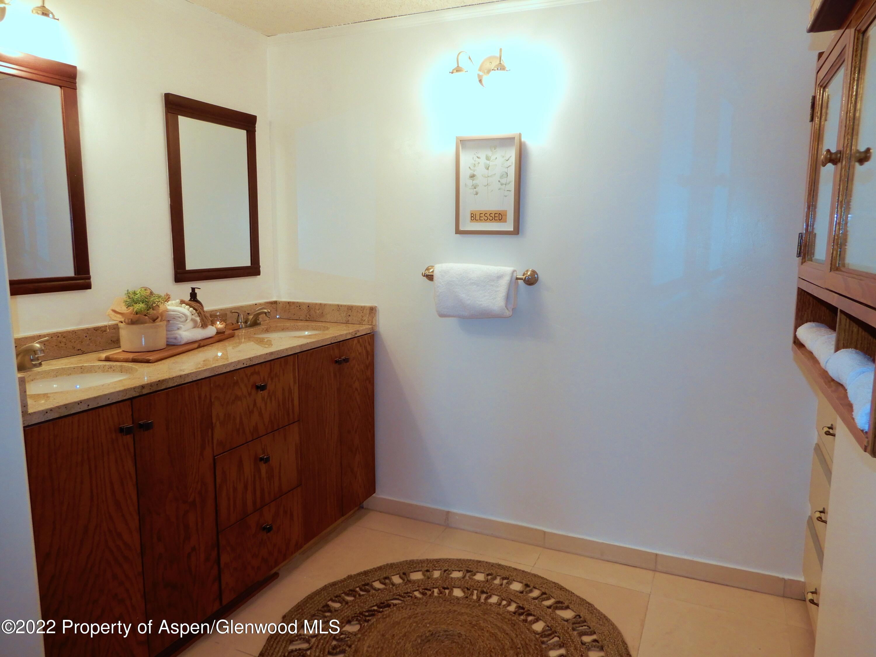 1110 Arnold Court Rifle, CO 81650 - Photo 21 of 23 a bathroom with a sink and a mirror
