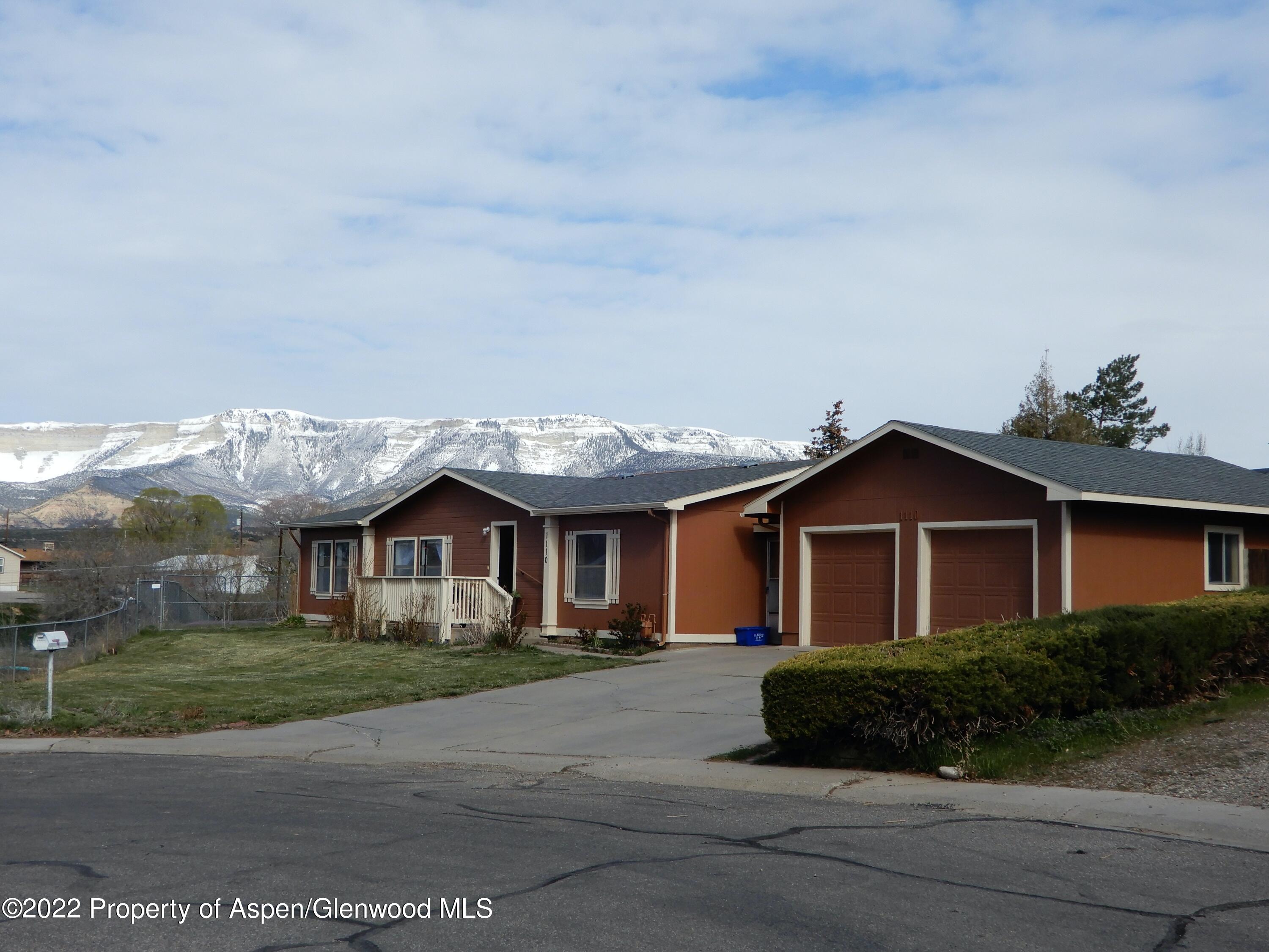 1110 Arnold Court Rifle, CO 81650 - Photo 23 of 23 a front view of a house with a garden