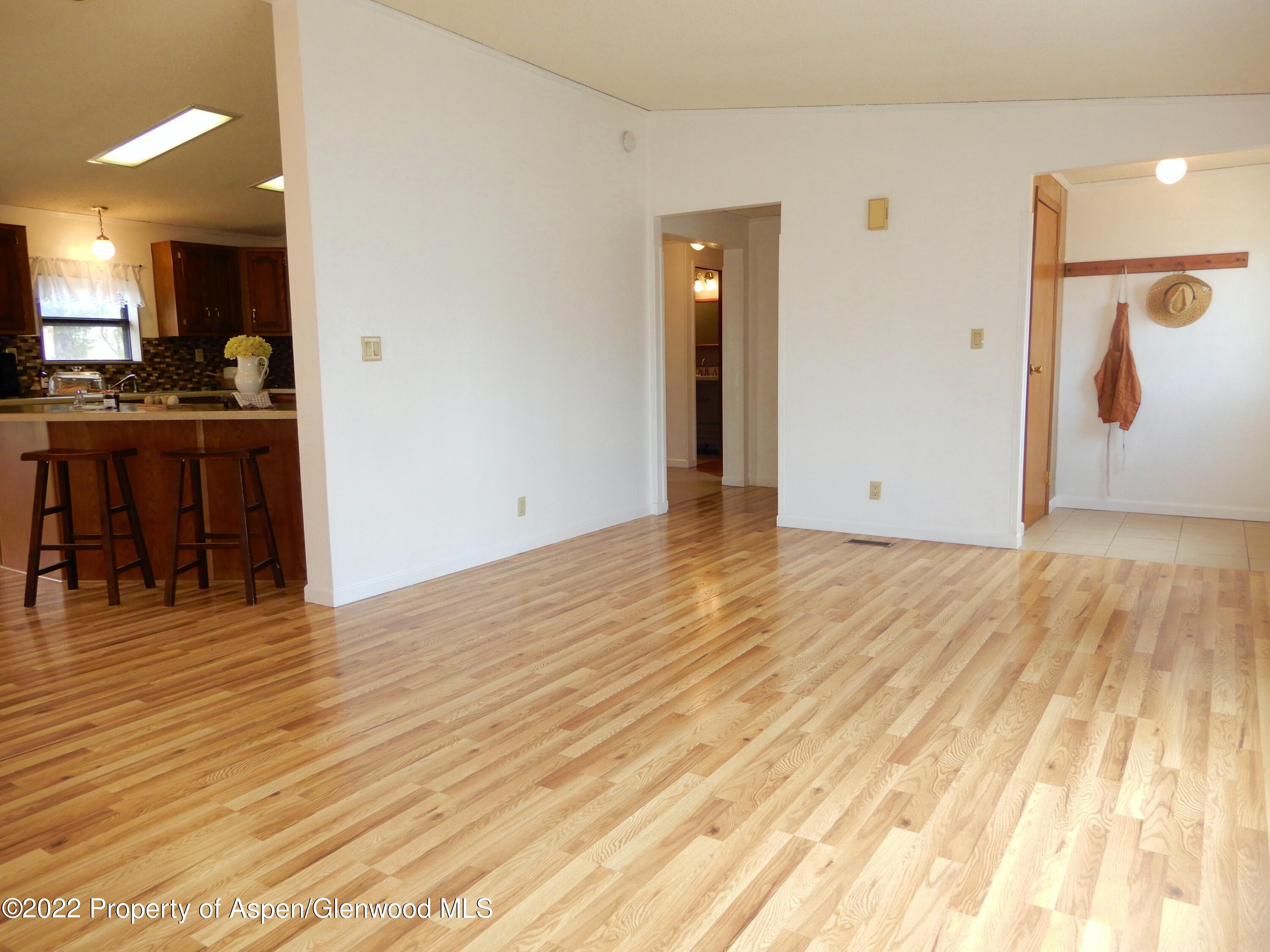 1110 Arnold Court Rifle, CO 81650 - Photo 5 of 23 a view of kitchen with furniture and wooden floor