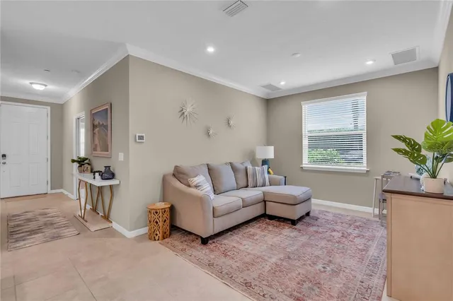 a living room with furniture and window