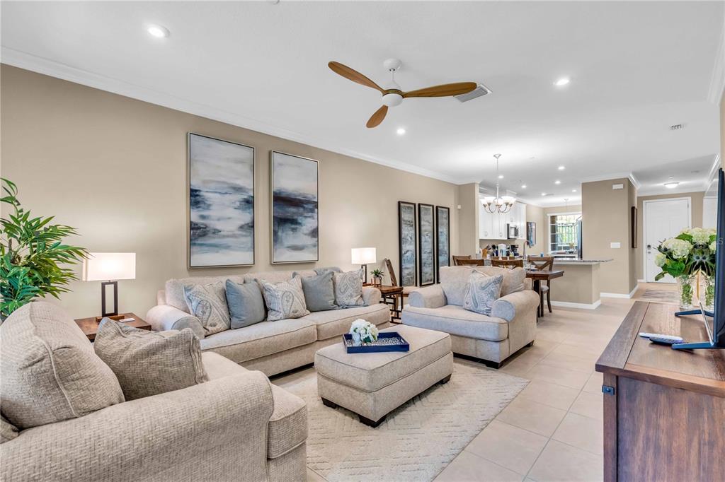 12413 Osorio Court, Unit 101 Sarasota, FL 34238 - Photo 2 of 46 a living room with furniture and a large window