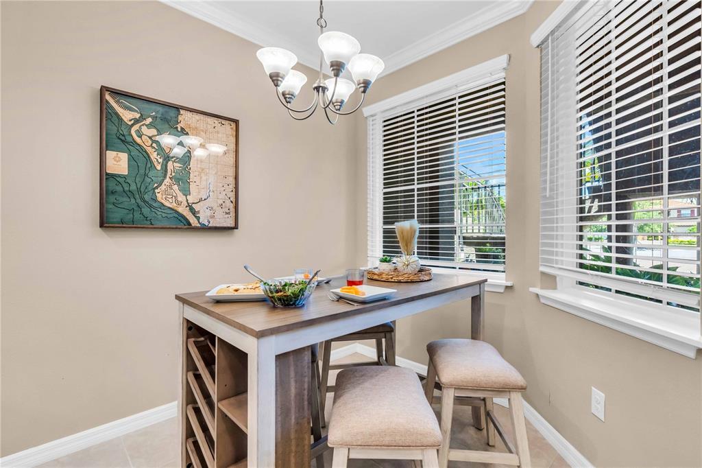 12413 Osorio Court, Unit 101 Sarasota, FL 34238 - Photo 3 of 46 a dining room with furniture and window