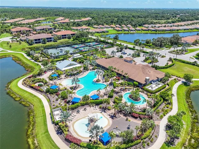 an aerial view of a swimming pool and mountain view