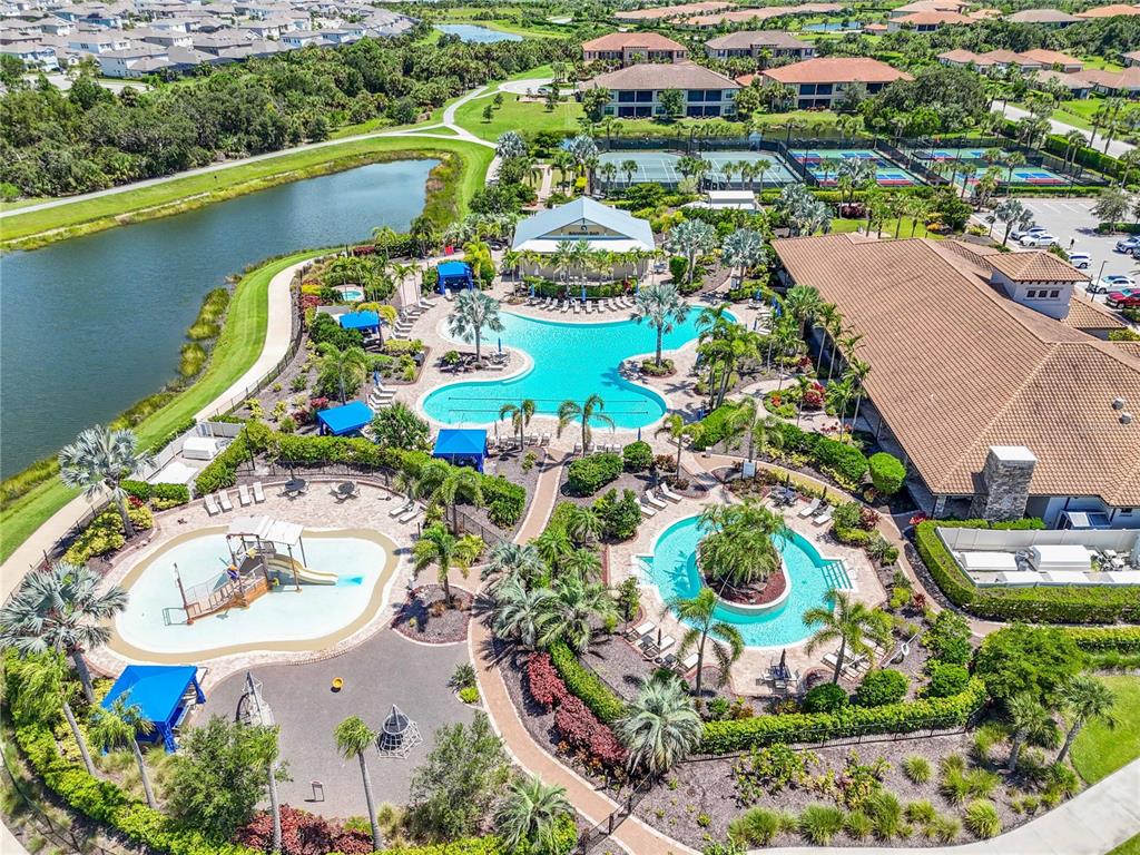 12413 Osorio Court, Unit 101 Sarasota, FL 34238 - Photo 44 of 46 an aerial view of a swimming pool a yard and plants