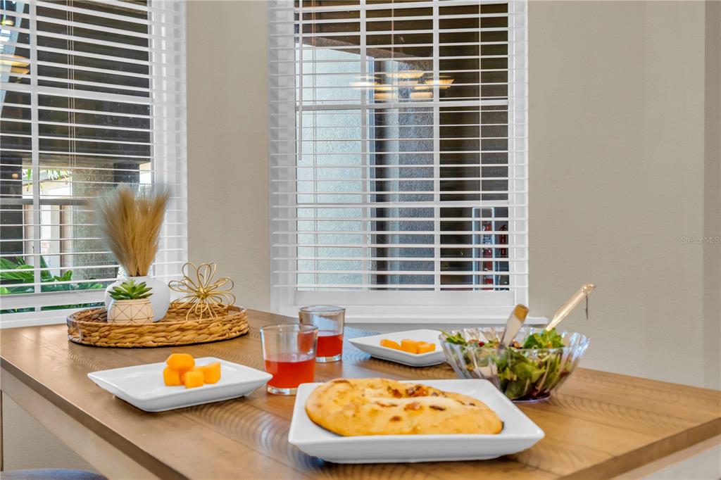 12413 Osorio Court, Unit 101 Sarasota, FL 34238 - Photo 6 of 46 a bathroom with a granite countertop sink and a mirror