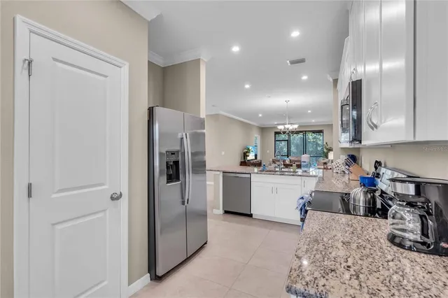 a kitchen with a refrigerator and sink