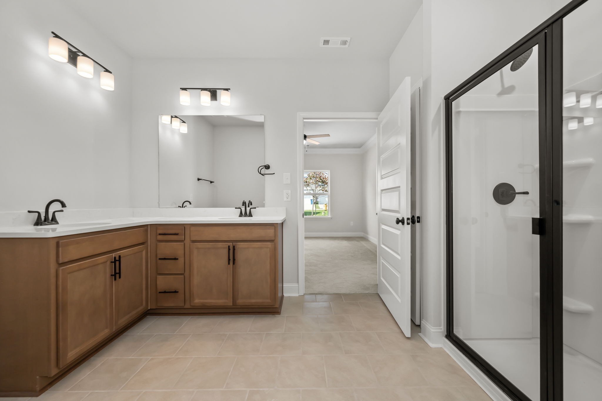 613 Rohan Drive Murfreesboro, TN 37129 - Photo 13 of 34 a spacious bathroom with a double vanity sink mirror and shower