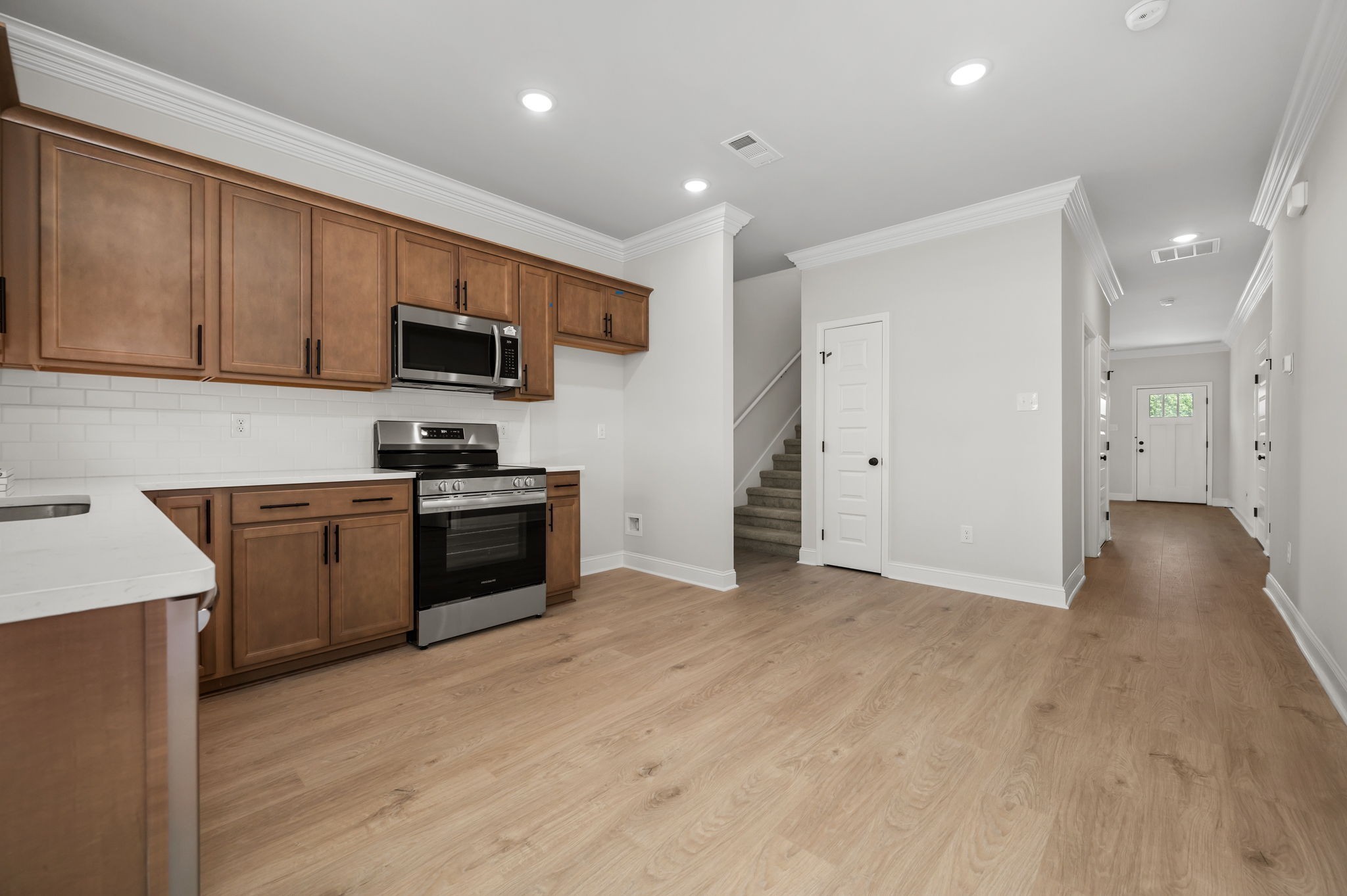 613 Rohan Drive Murfreesboro, TN 37129 - Photo 2 of 34 a kitchen with a sink a stove and cabinets