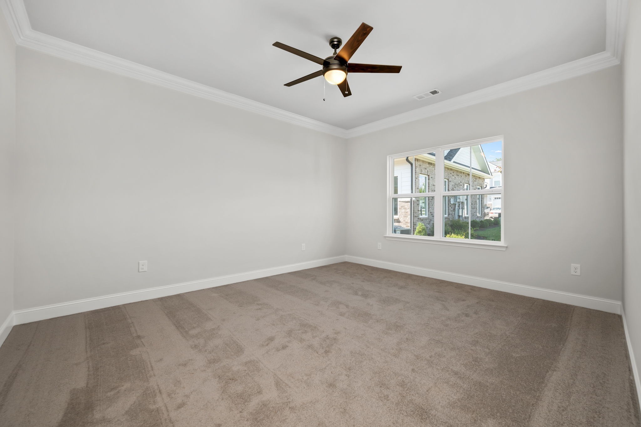 613 Rohan Drive Murfreesboro, TN 37129 - Photo 10 of 34 an empty room with windows and ceiling fan