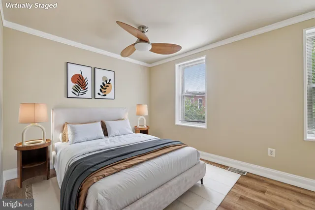 a bedroom with a large bed and a window