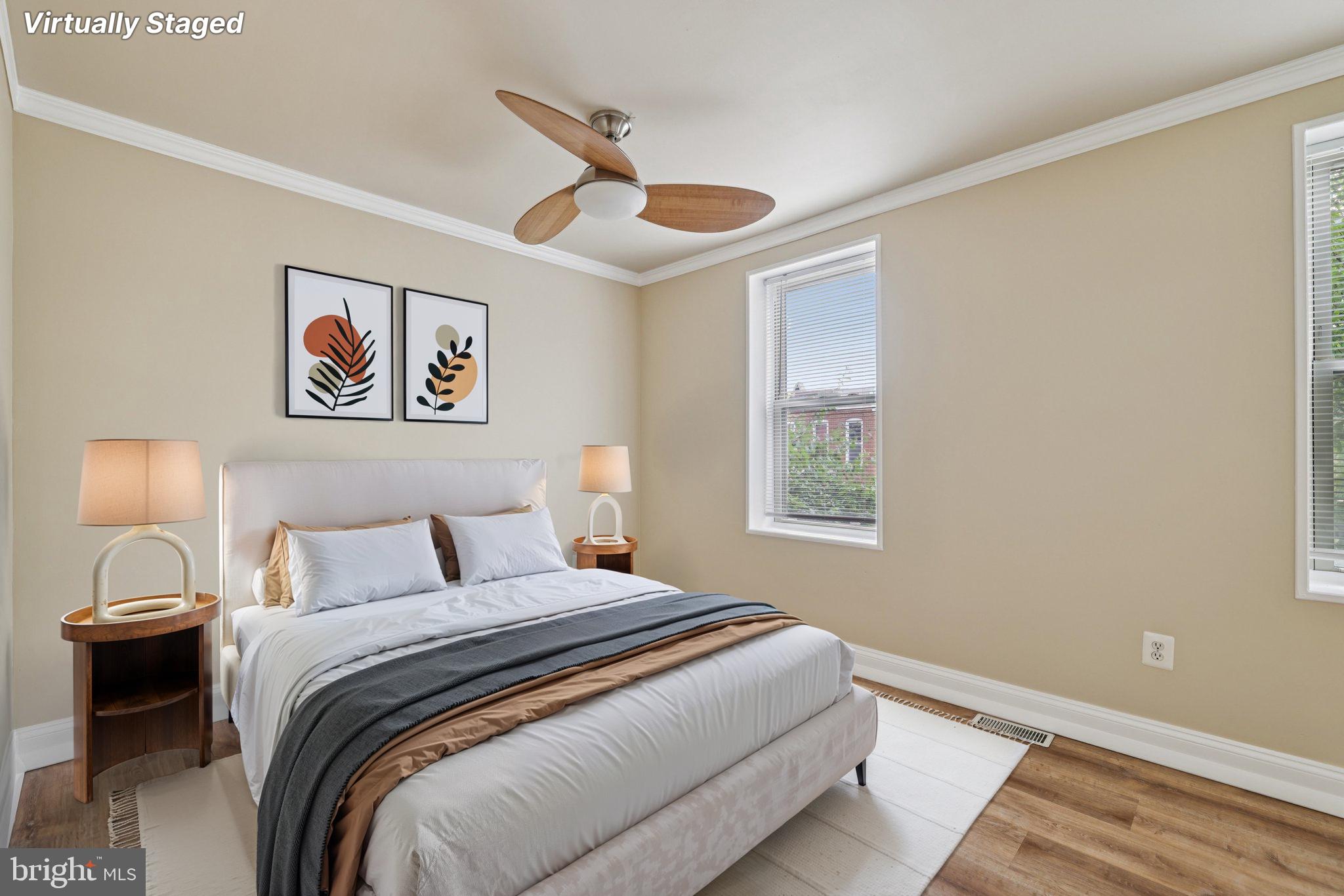 410 North Chester Street Baltimore, MD 21231 - Photo 15 of 24 a bedroom with a large bed and a window