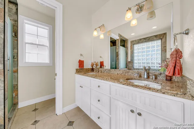 a bathroom with a tub and shower