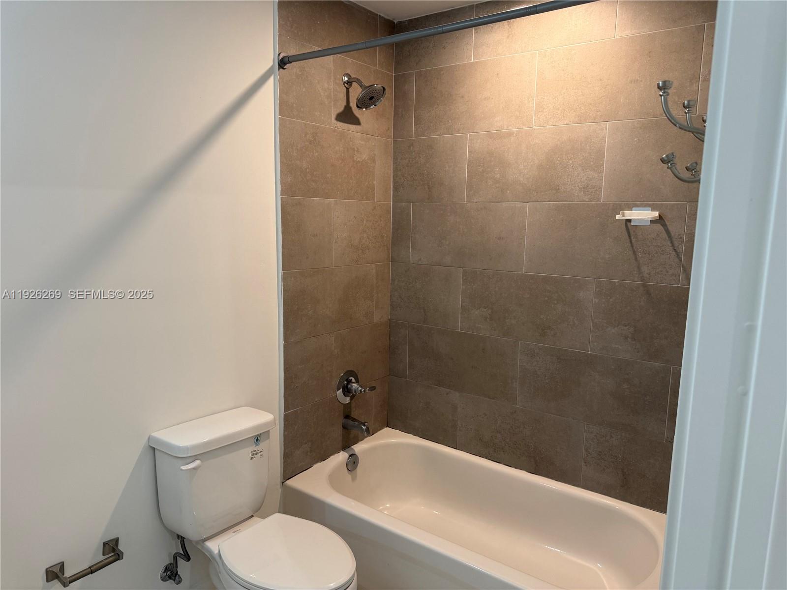 420 Southwest 7th Avenue, Unit 101 Miami, FL 33130 - Photo 15 of 16 a bathroom with a sink and a toilet