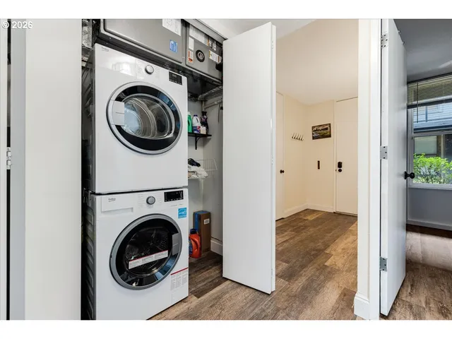 a view of livingroom with washer and dryer