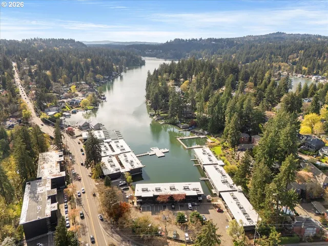 an aerial view of house with yard and ocean view