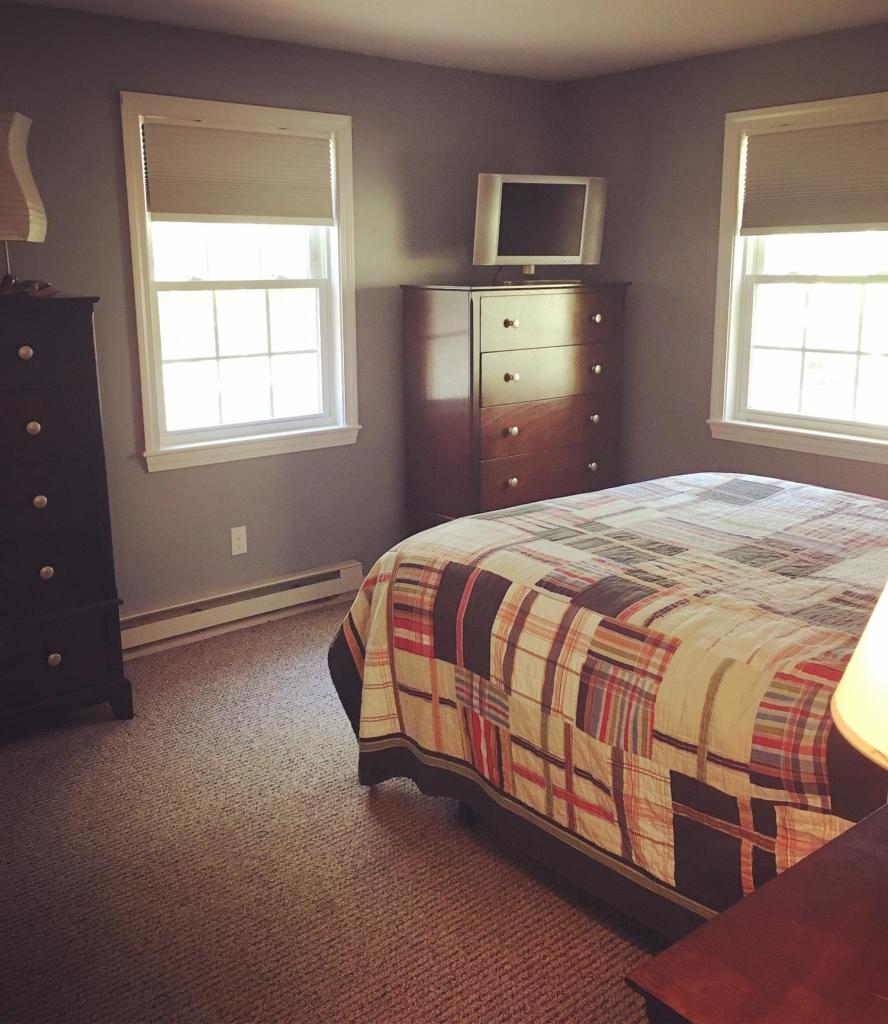29 Snake Pond Road Forestdale, MA 02644 - Photo 11 of 18 a spacious bedroom with a bed and a window