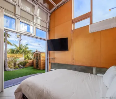 a bedroom with a bed and cabinets
