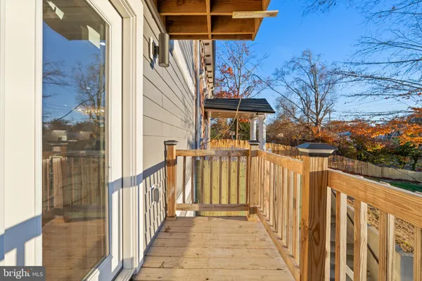 a view of a house with wooden fence