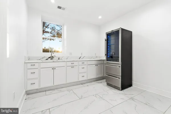 a bedroom with a bed potted plant with the mirror