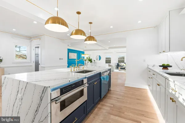 a kitchen with a stove and a sink