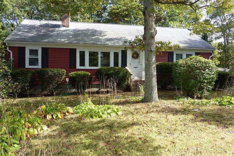 a front view of house with yard outdoor seating and barbeque oven