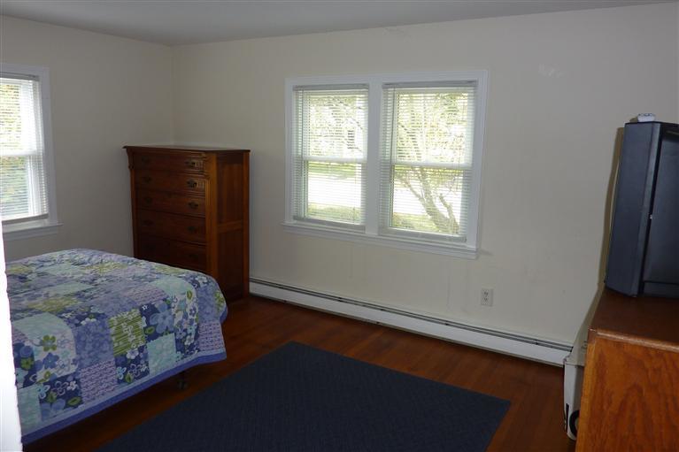 34 Wolley Road Hyannis, MA 02601 - Photo 11 of 19 a bedroom with a bed and a window