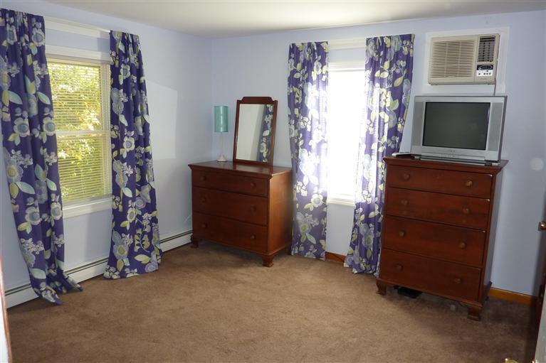 34 Wolley Road Hyannis, MA 02601 - Photo 13 of 19 a living room with furniture and a flat screen tv
