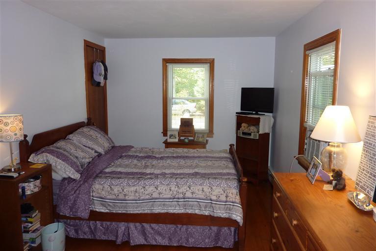 34 Wolley Road Hyannis, MA 02601 - Photo 15 of 19 a bedroom with a bed and a flat screen tv