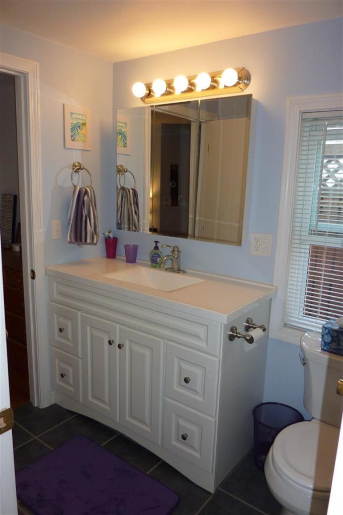 34 Wolley Road Hyannis, MA 02601 - Photo 17 of 19 a bathroom with a toilet sink and mirror