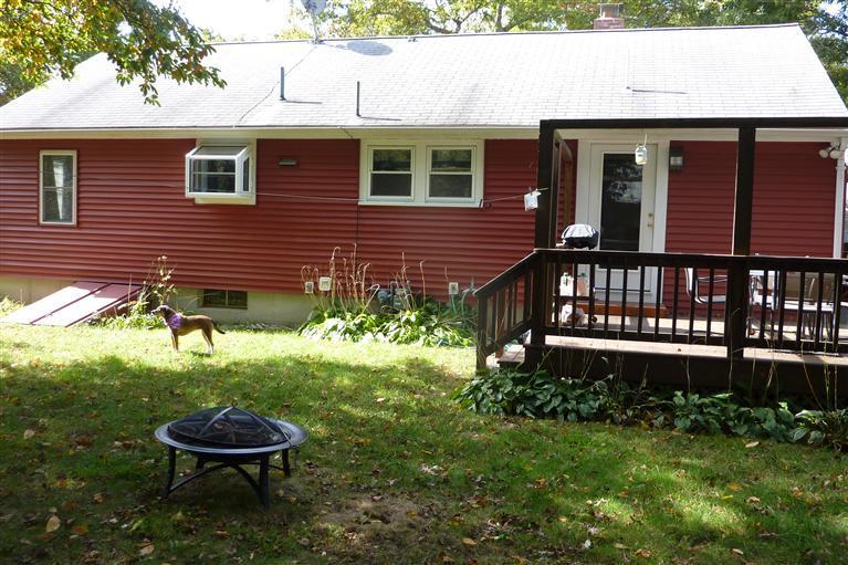 34 Wolley Road Hyannis, MA 02601 - Photo 2 of 19 a front view of a house with a yard