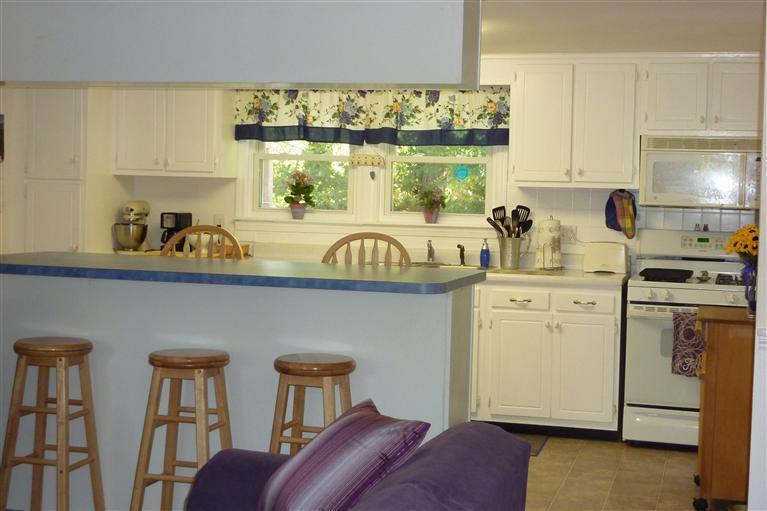 34 Wolley Road Hyannis, MA 02601 - Photo 5 of 19 a kitchen that has a cabinets counter space and a window