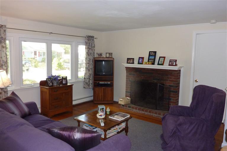 34 Wolley Road Hyannis, MA 02601 - Photo 7 of 19 a living room with furniture and a fireplace