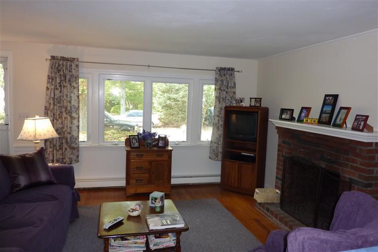 34 Wolley Road Hyannis, MA 02601 - Photo 8 of 19 a living room with furniture and a fireplace